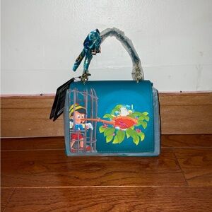 NWT Disney Loungefly Pinocchio Blue Bird nest Crossbody Handbag with a Bow